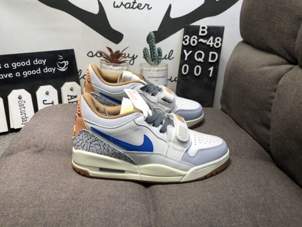 "Nike Air Jordan Legacy 312 lateral, destacando o design híbrido e a tira de velcro."